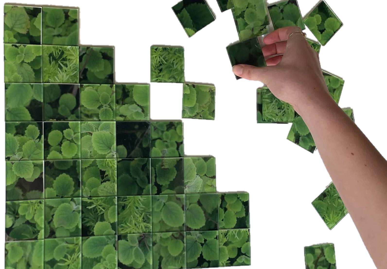 Living Grid tiles being arranged by hand